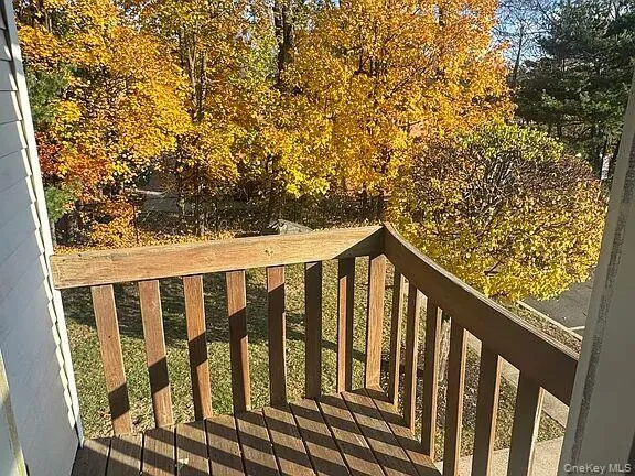 a balcony view with wooden floor and fence