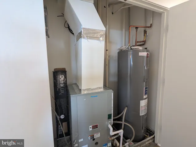 a view of a big room with wooden floor and cabinet