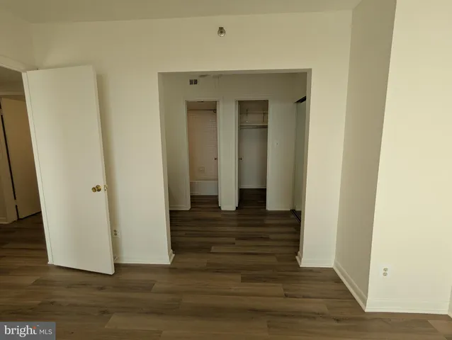 a view of a balcony with wooden floor