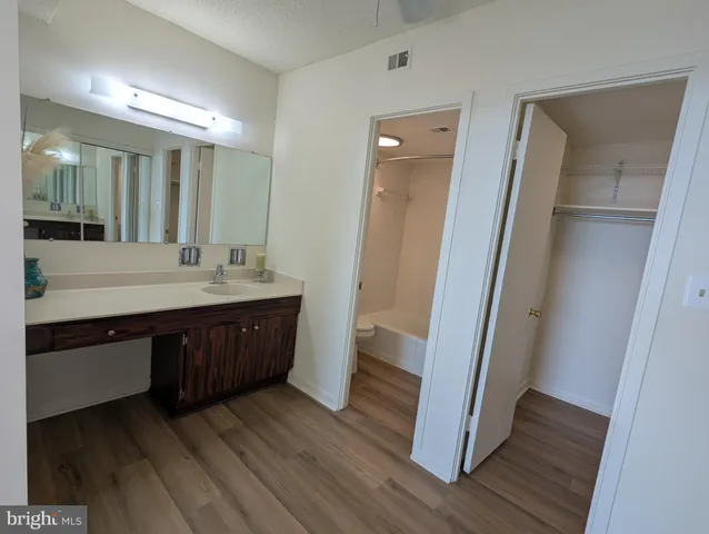 a sign that is sitting on a wooden floor