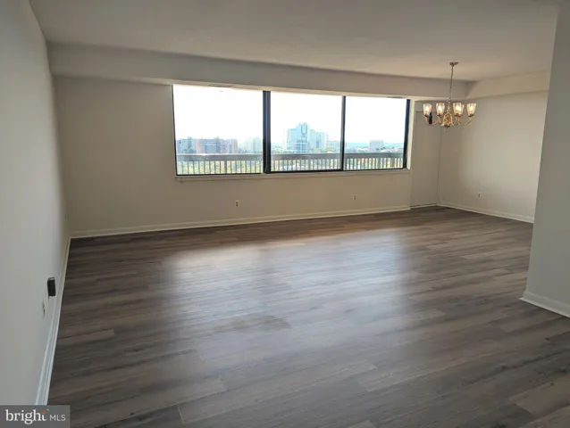 a view of a kitchen from the hallway