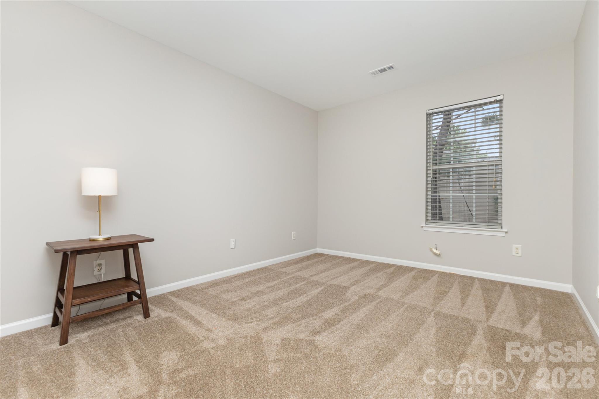 3832 Thomas Ridge Drive Charlotte, NC 28269 - Photo 21 of 33 a view of an empty room with a window