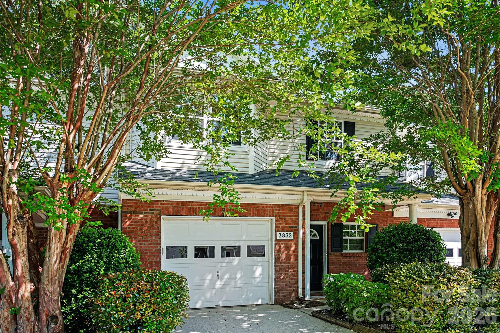3832 Thomas Ridge Drive Charlotte, NC 28269 - Photo 25 of 33 front view of a building with a tree
