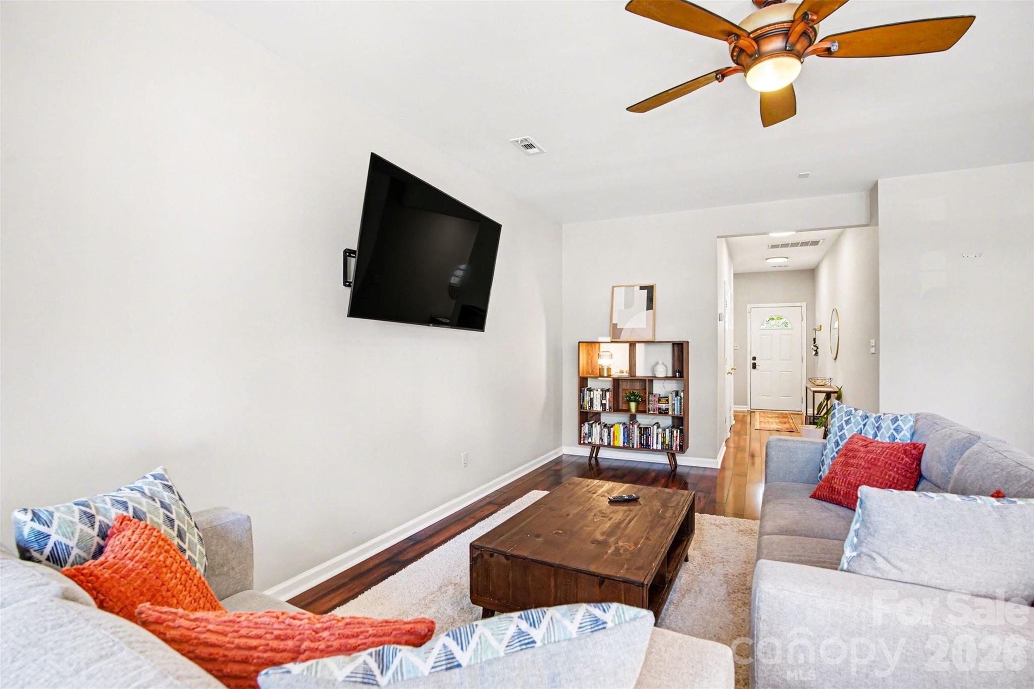 3832 Thomas Ridge Drive Charlotte, NC 28269 - Photo 26 of 33 a living room with furniture and a flat screen tv