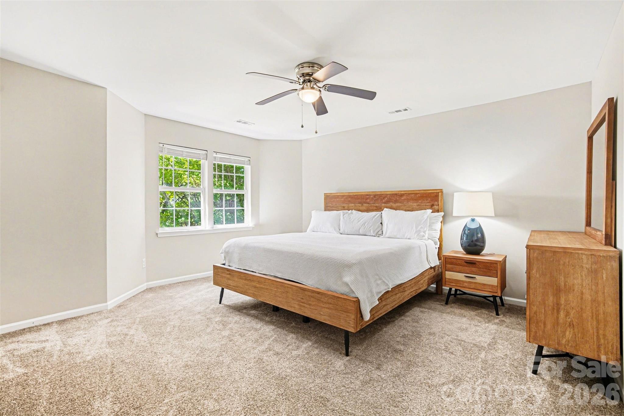 3832 Thomas Ridge Drive Charlotte, NC 28269 - Photo 28 of 33 a bedroom with a bed and window
