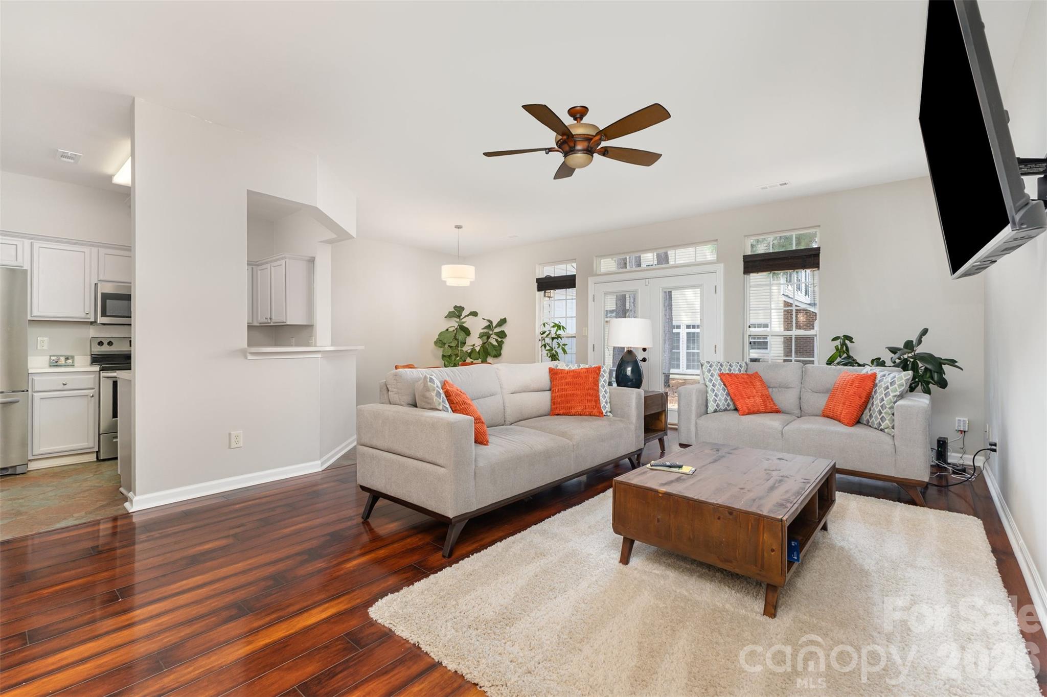 3832 Thomas Ridge Drive Charlotte, NC 28269 - Photo 3 of 33 a living room with furniture and a flat screen tv