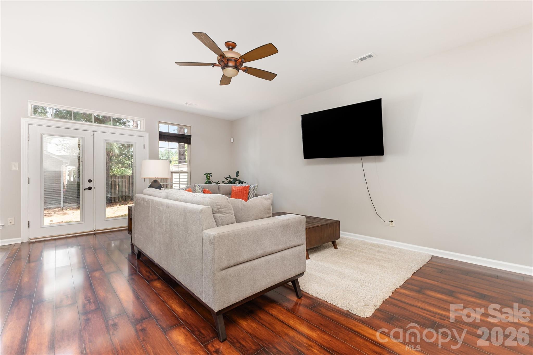 3832 Thomas Ridge Drive Charlotte, NC 28269 - Photo 7 of 33 a living room with furniture and a flat screen tv