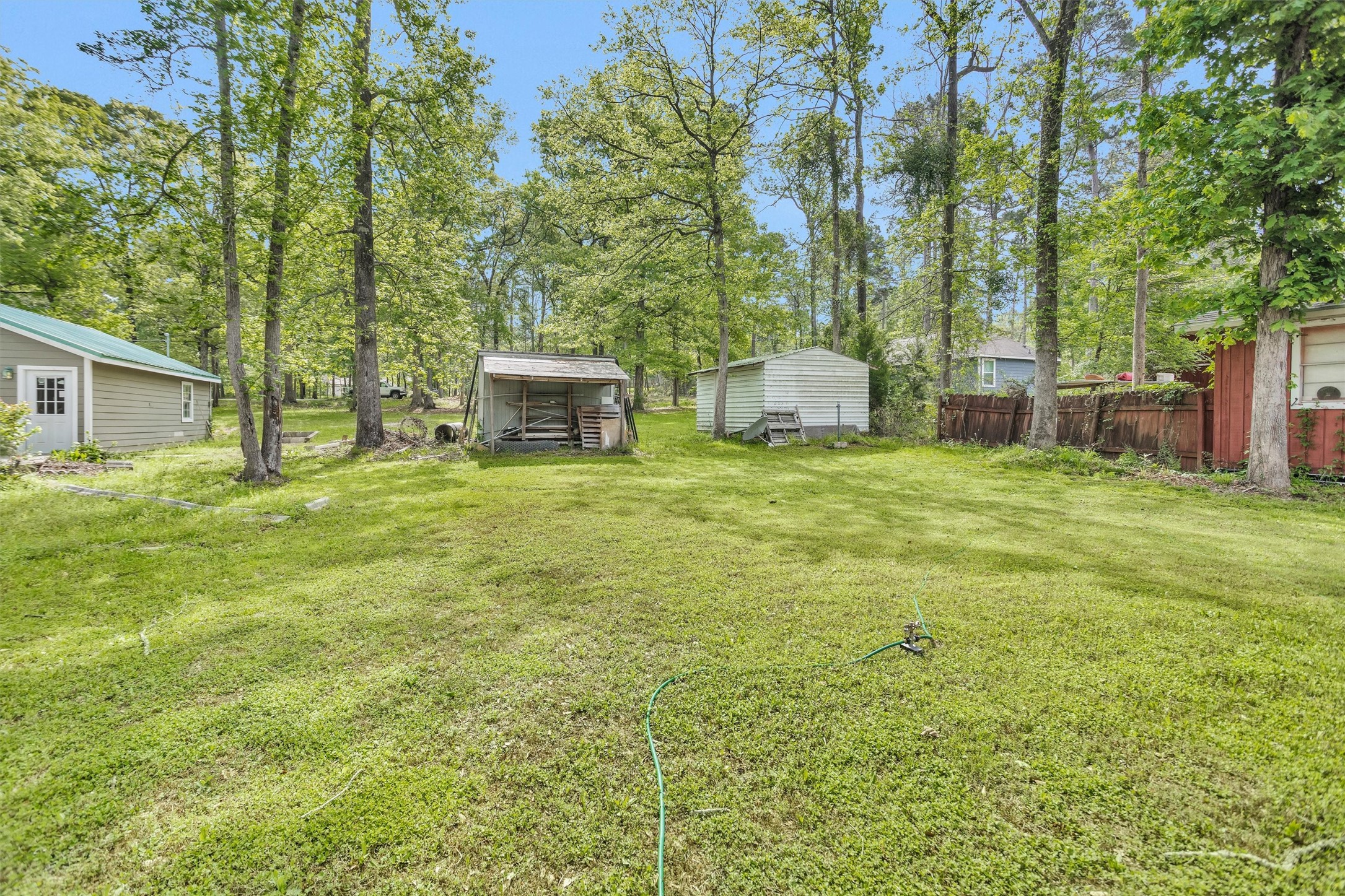 15134 Austin Road Willis, TX 77378 - Photo 19 of 20 a view of a house with backyard