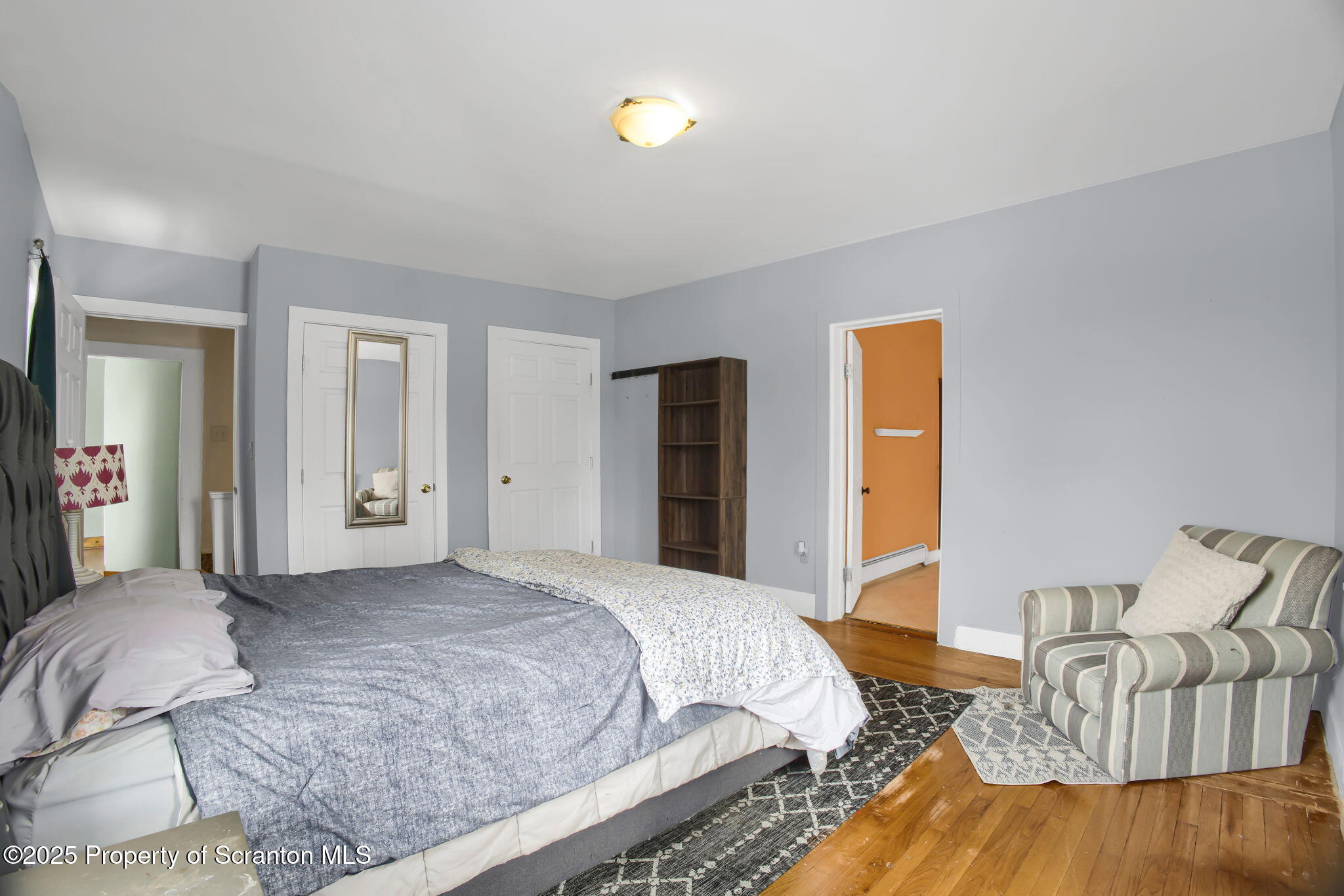 654 Cribbs Road Poyntelle, PA 18454 - Photo 15 of 67 a bedroom with a bed and a couch