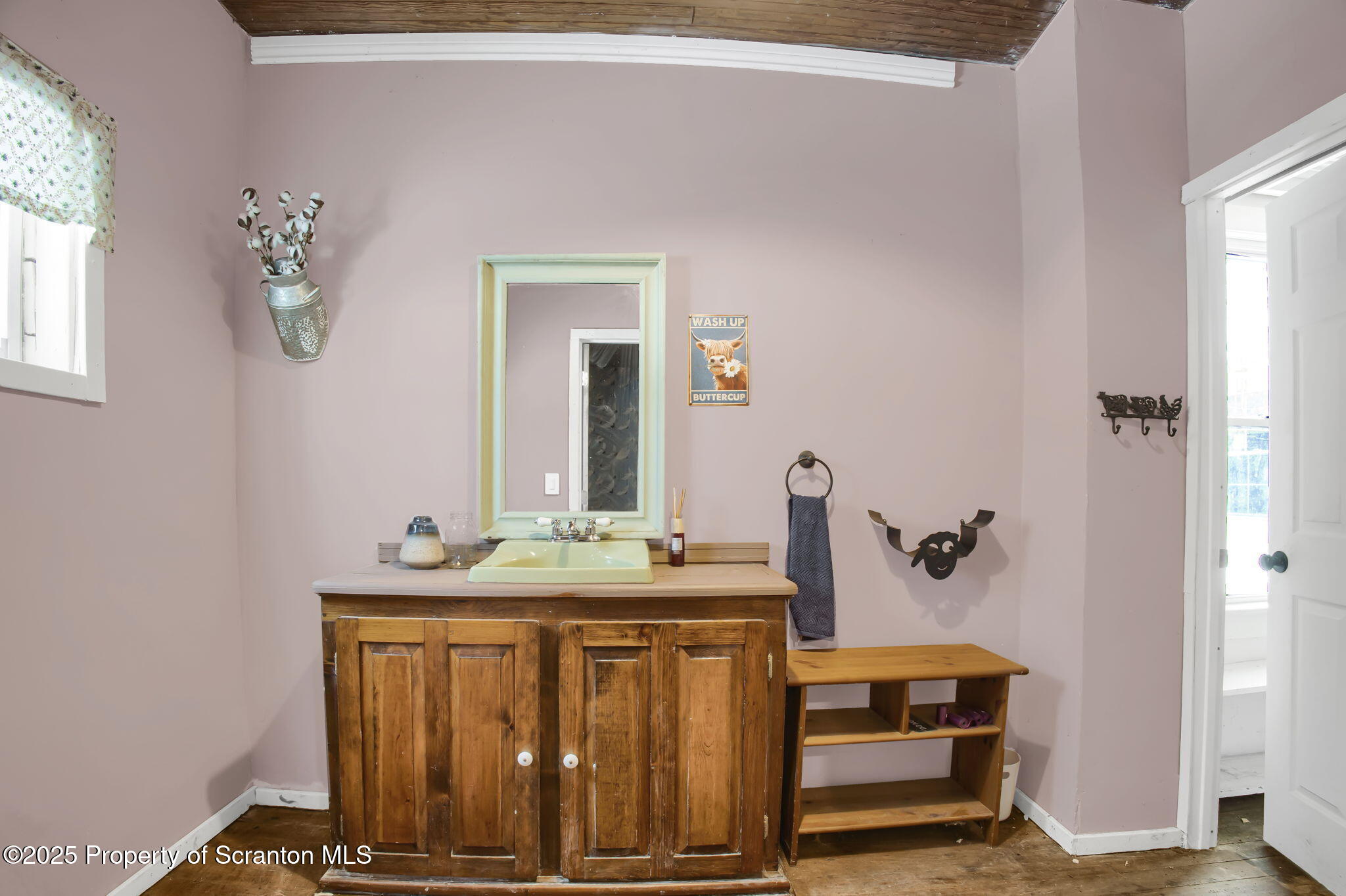 654 Cribbs Road Poyntelle, PA 18454 - Photo 18 of 67 a bathroom with a sink and a mirror