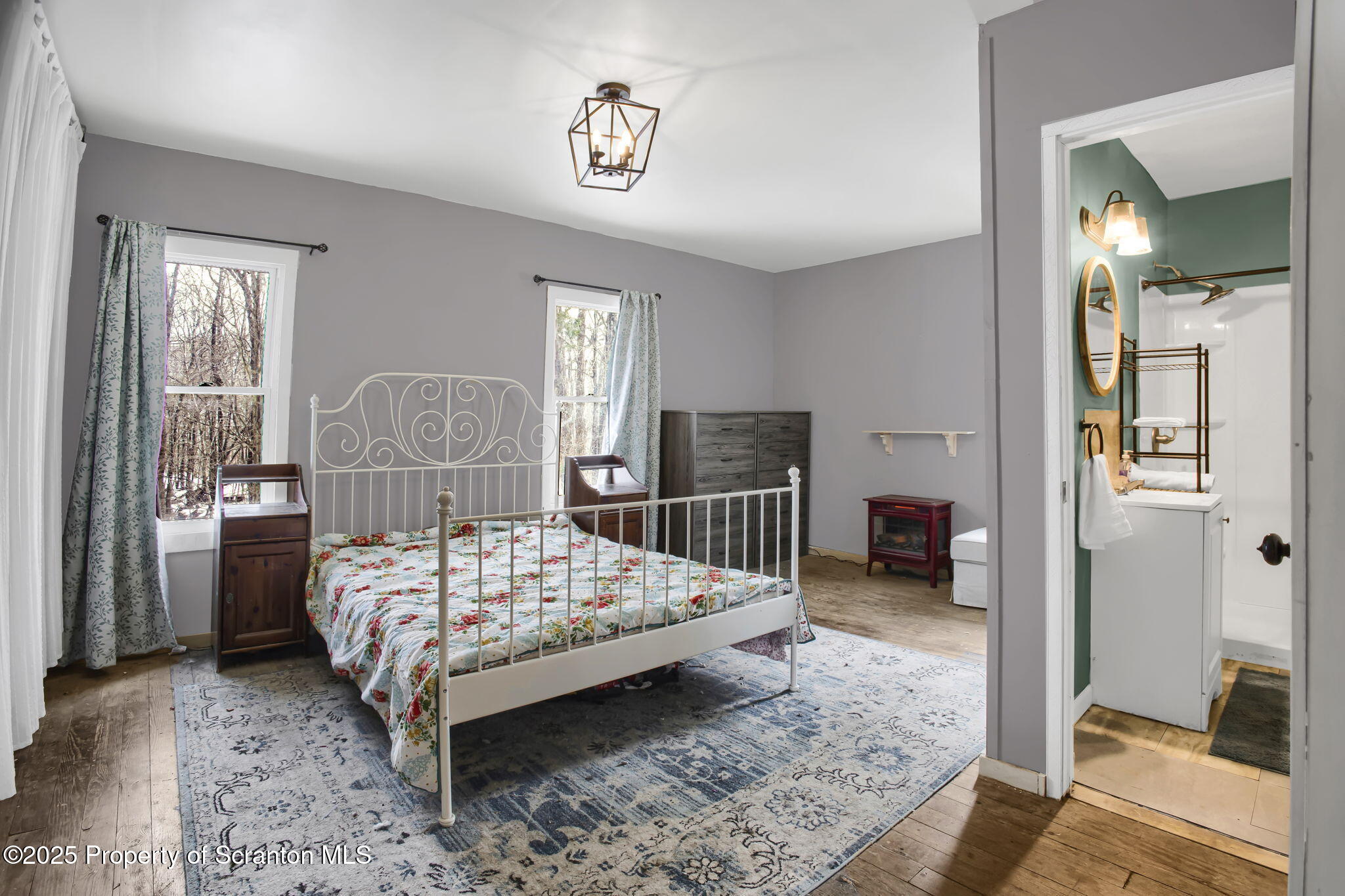 654 Cribbs Road Poyntelle, PA 18454 - Photo 24 of 67 a bedroom with a bed and large closet