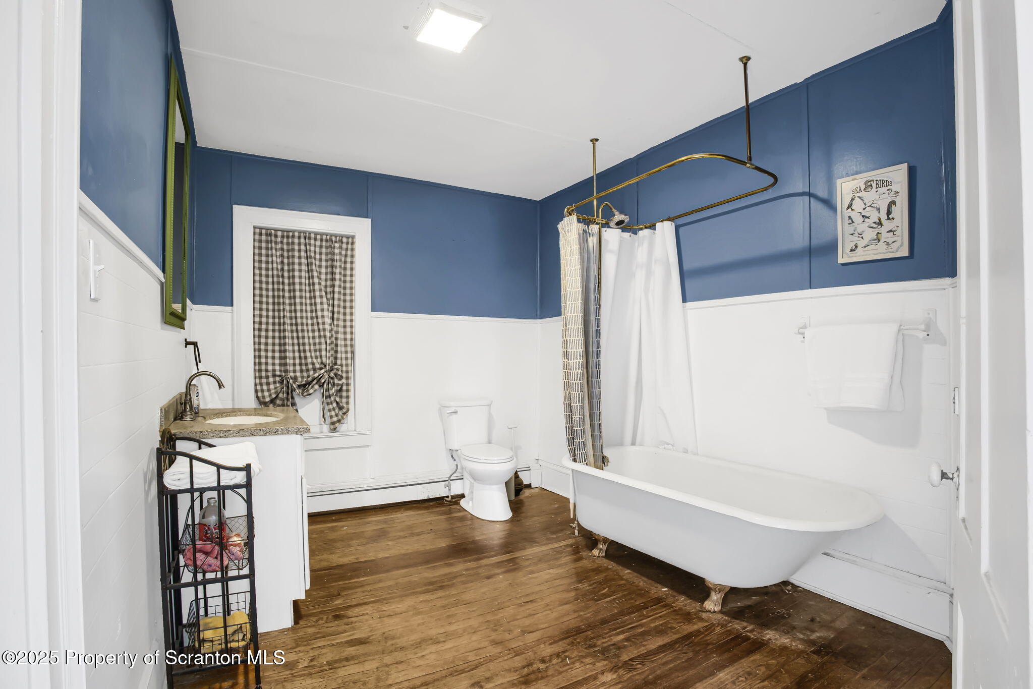 654 Cribbs Road Poyntelle, PA 18454 - Photo 26 of 67 a bathroom with a bathtub and a shower