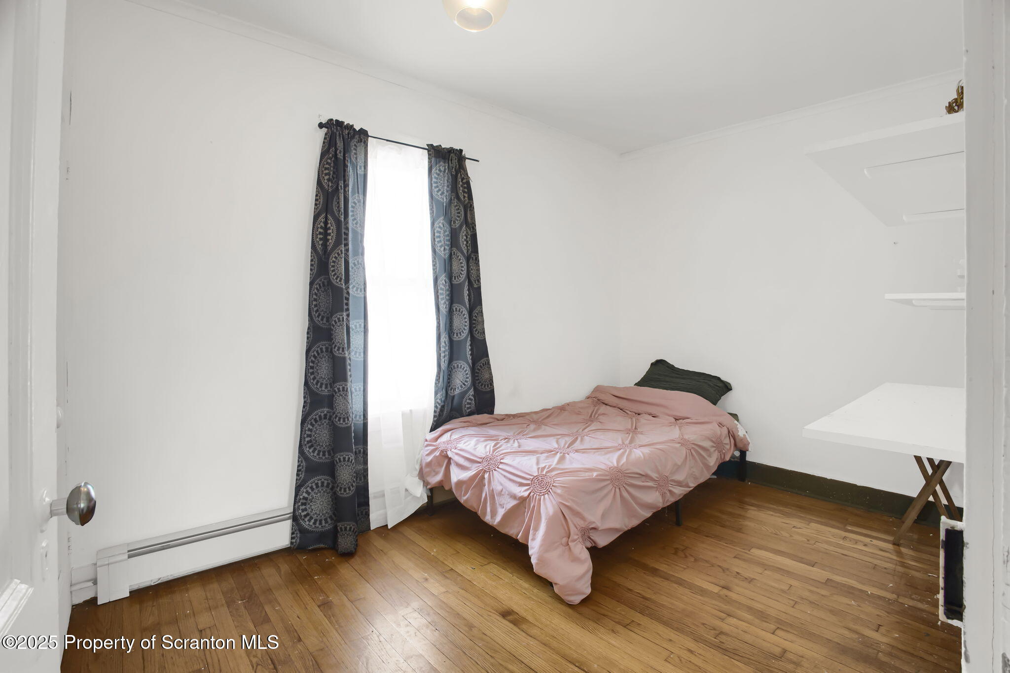654 Cribbs Road Poyntelle, PA 18454 - Photo 30 of 67 a bedroom with a bed and a window