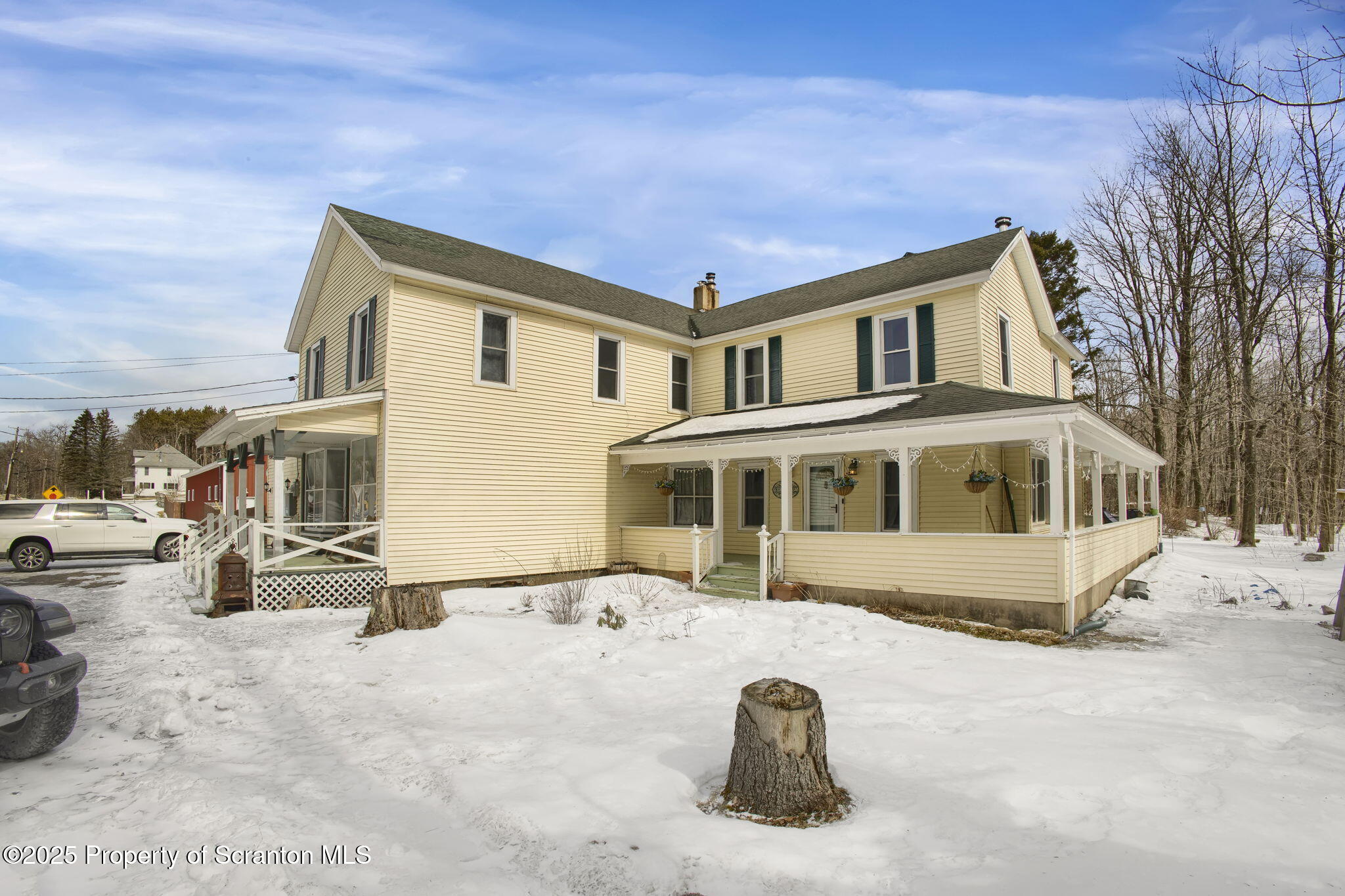 654 Cribbs Road Poyntelle, PA 18454 - Photo 3 of 67 a front view of a house with a yard covered with snow