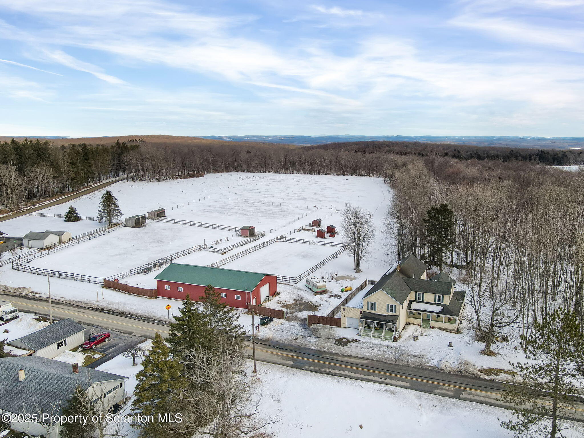 654 Cribbs Road Poyntelle, PA 18454 - Photo 37 of 67 an aerial view of a house with a yard and lake view