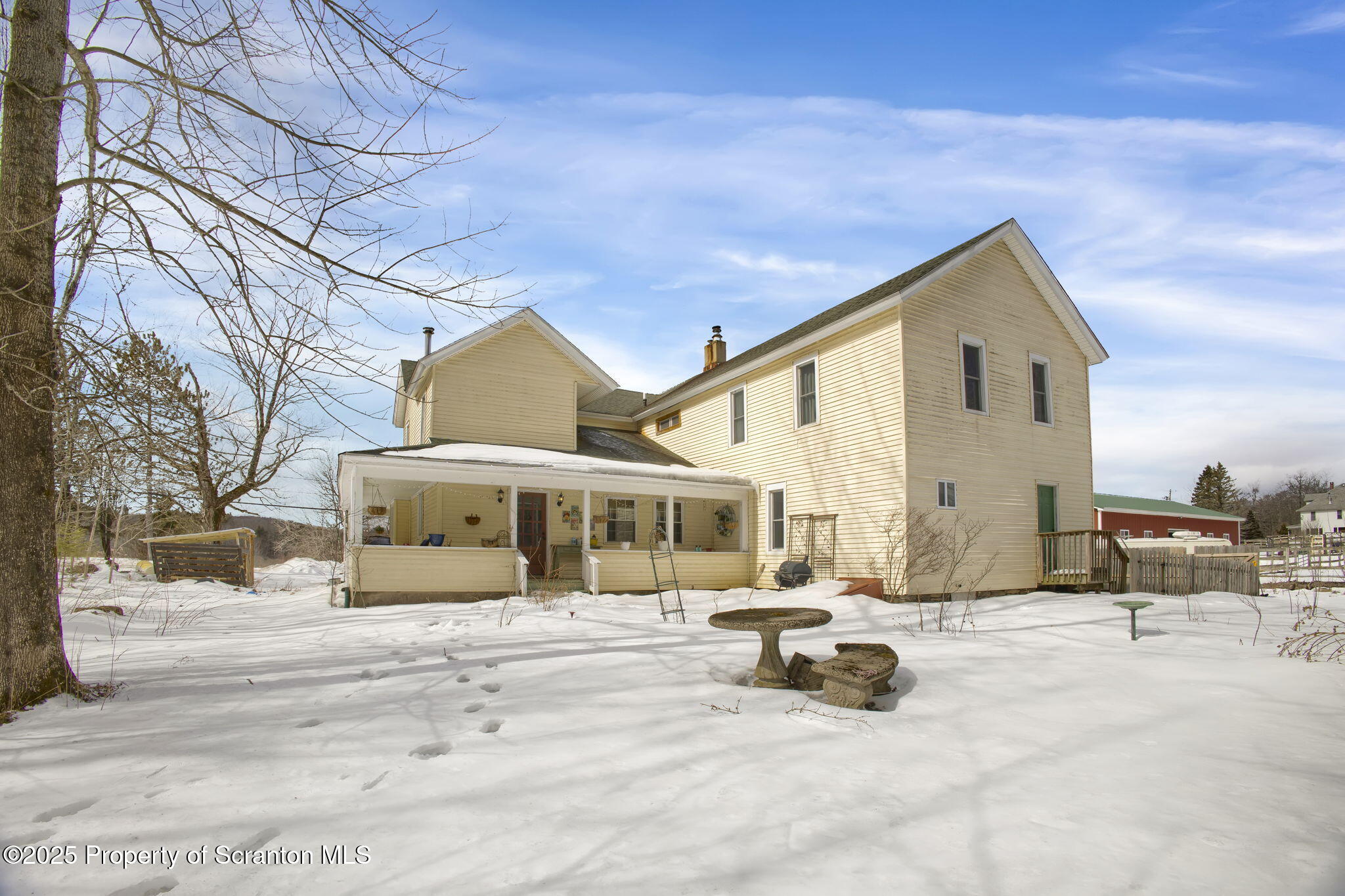654 Cribbs Road Poyntelle, PA 18454 - Photo 6 of 67 a view of a house with snow on the road