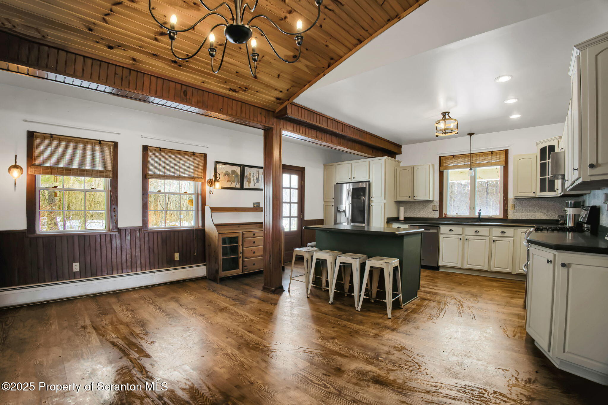 654 Cribbs Road Poyntelle, PA 18454 - Photo 8 of 67 a living room with stainless steel appliances granite countertop furniture wooden floor and a kitchen view