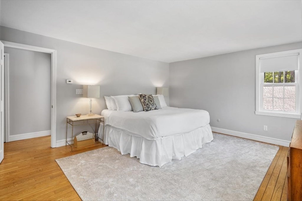 21 Berkley Circle Hingham, MA 02043 - Photo 14 of 34 a bedroom with a bed and a couch