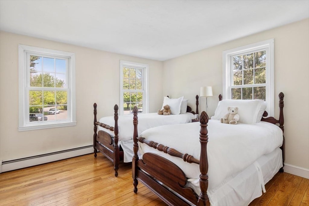 21 Berkley Circle Hingham, MA 02043 - Photo 17 of 34 a bed room with a bed and a chair