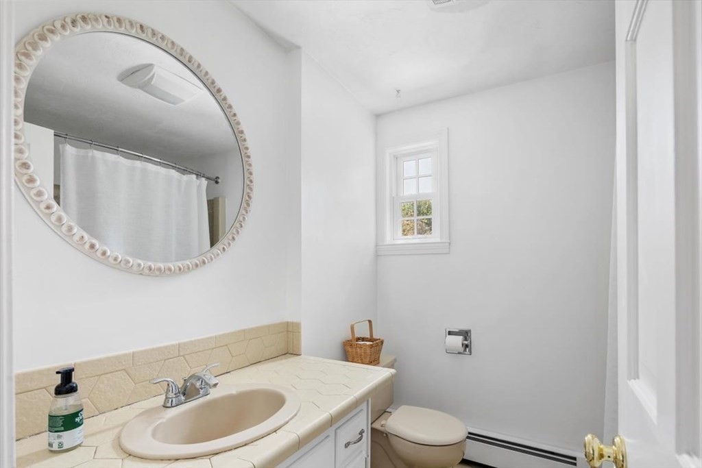 21 Berkley Circle Hingham, MA 02043 - Photo 18 of 34 a bathroom with a toilet a sink and mirror