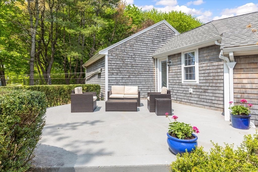21 Berkley Circle Hingham, MA 02043 - Photo 20 of 34 a view of a patio with a chairs and potted plants
