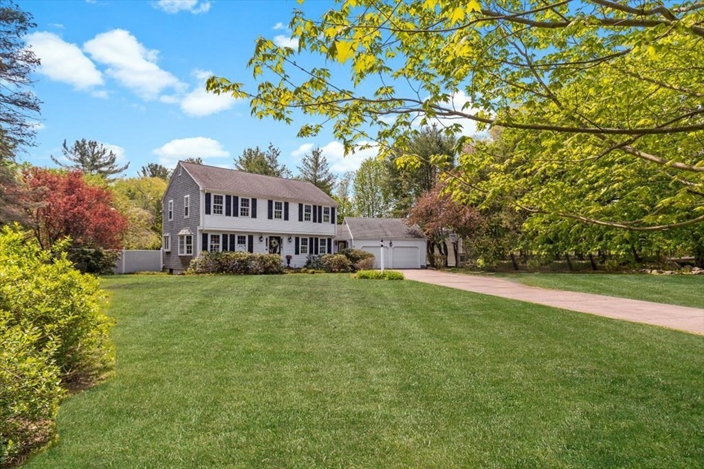 21 Berkley Circle Hingham, MA 02043 - Photo 30 of 34 a view of a house with a big yard and large trees