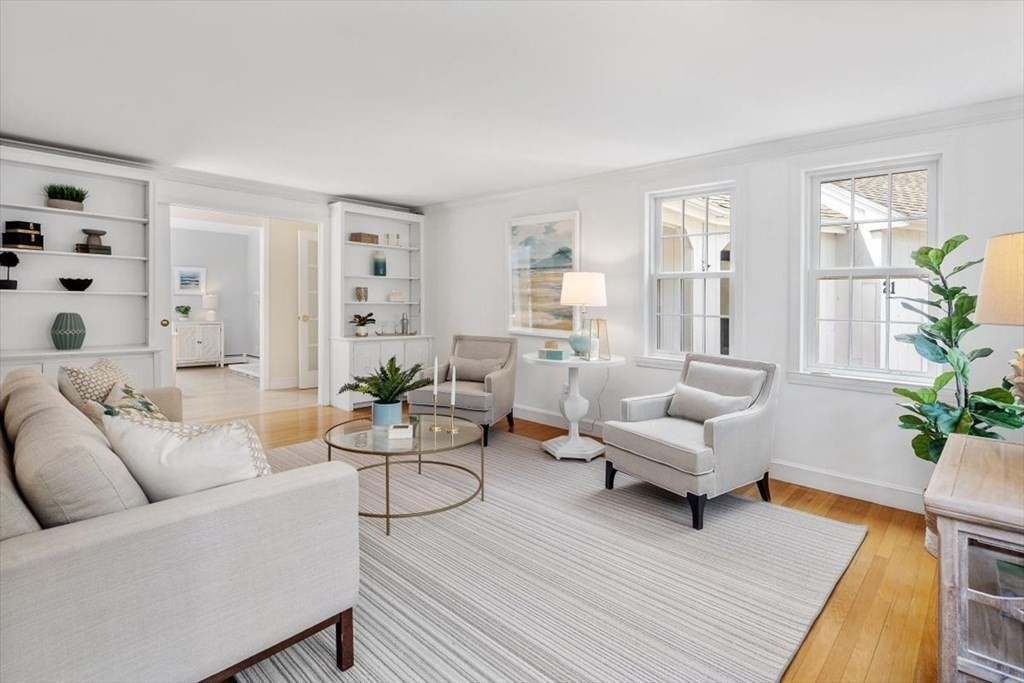 21 Berkley Circle Hingham, MA 02043 - Photo 7 of 34 a living room with furniture and a large window