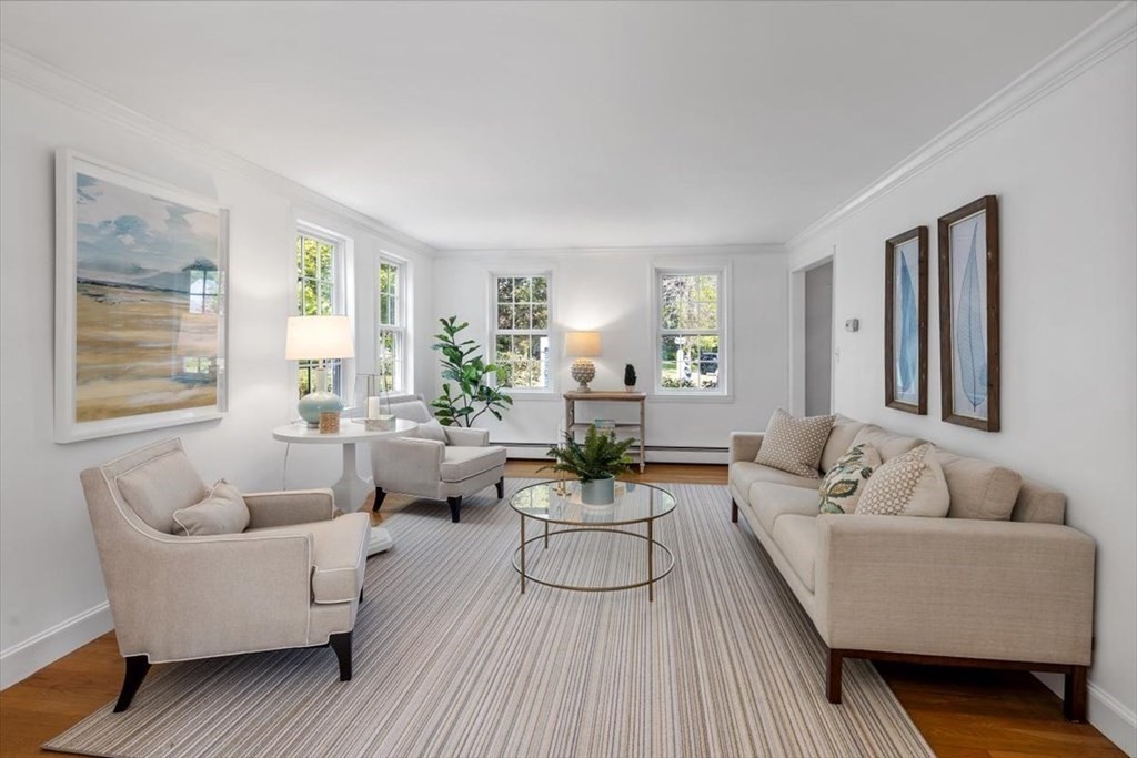 21 Berkley Circle Hingham, MA 02043 - Photo 8 of 34 a living room with furniture and a large window