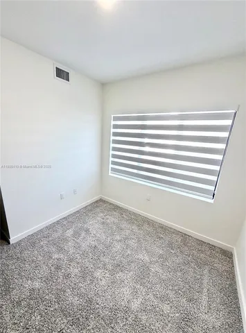 a view of a room that has a window in it