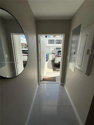 a view of a hallway view with staircase