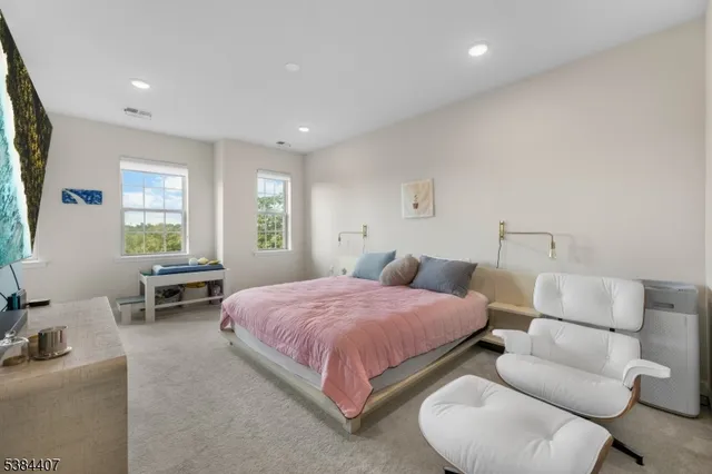 a view of walk in closet with clothes