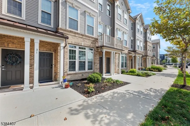 a front view of a building with a yard