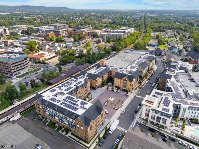 an aerial view of a residential houses with outdoor space