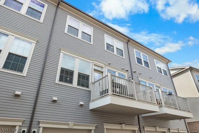 a balcony view with a outdoor seating
