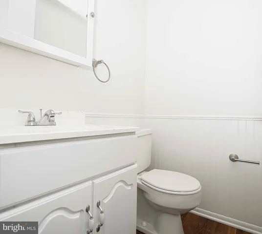 a bathroom with a toilet and a sink