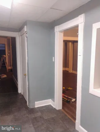 a white toilet sitting next to a bath tub