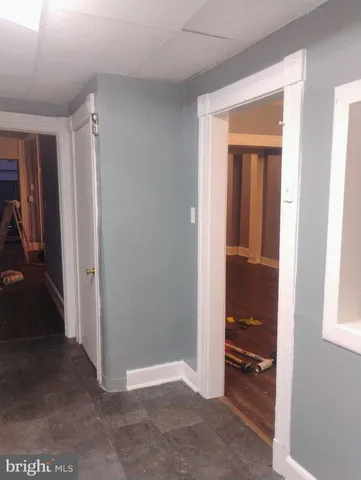 a white toilet sitting next to a bath tub