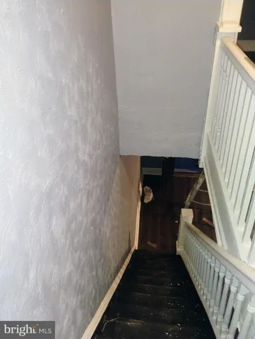 a kitchen with a sink and a stove top oven