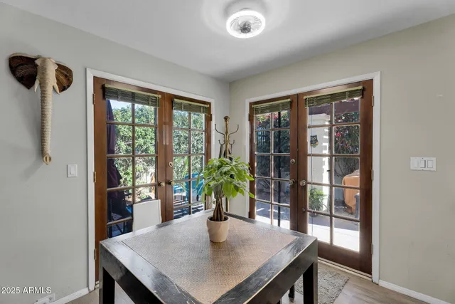 a kitchen that has a microwave a stove and a table in it
