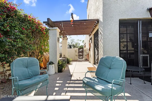 a backyard of a house with seating space