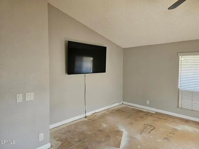 a living room with a flat screen tv