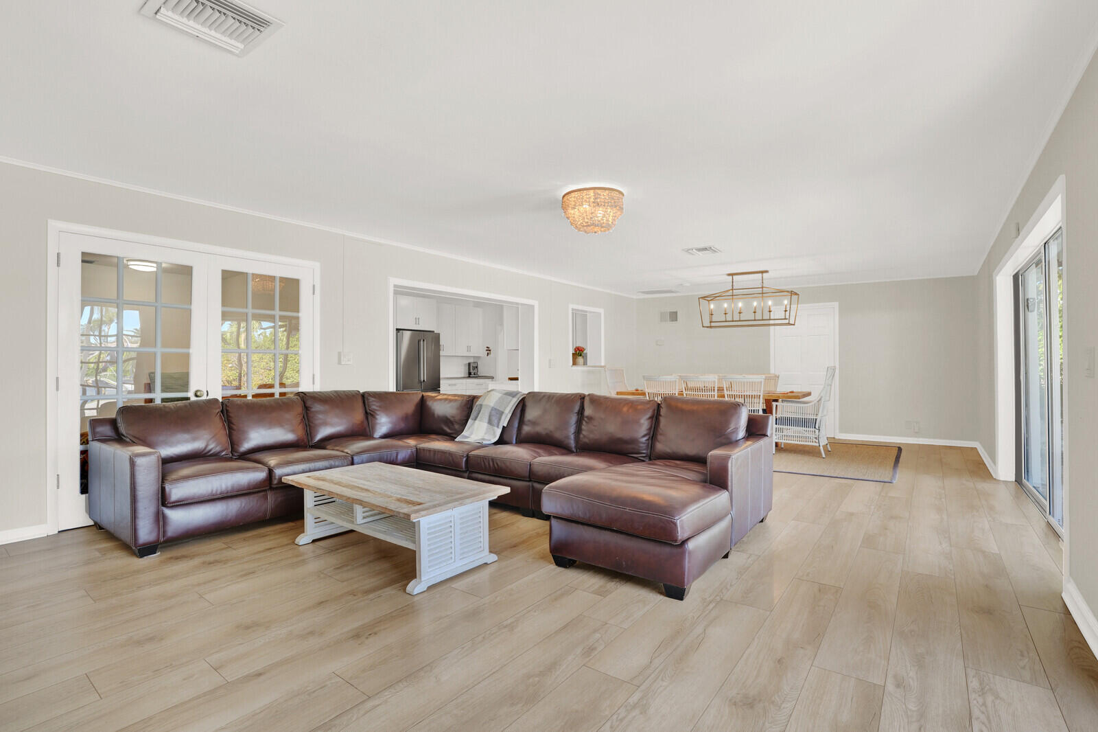 12980 Prosperity Farms Road Palm Beach Gardens, FL 33410 - Photo 20 of 55 a living room with furniture and a wooden floor
