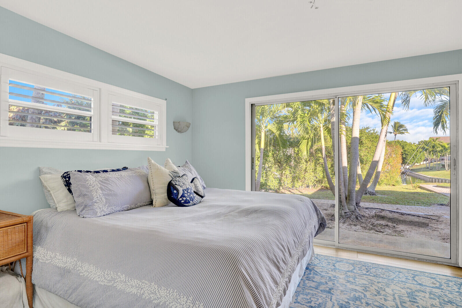 12980 Prosperity Farms Road Palm Beach Gardens, FL 33410 - Photo 23 of 55 a bedroom with a large bed and a window