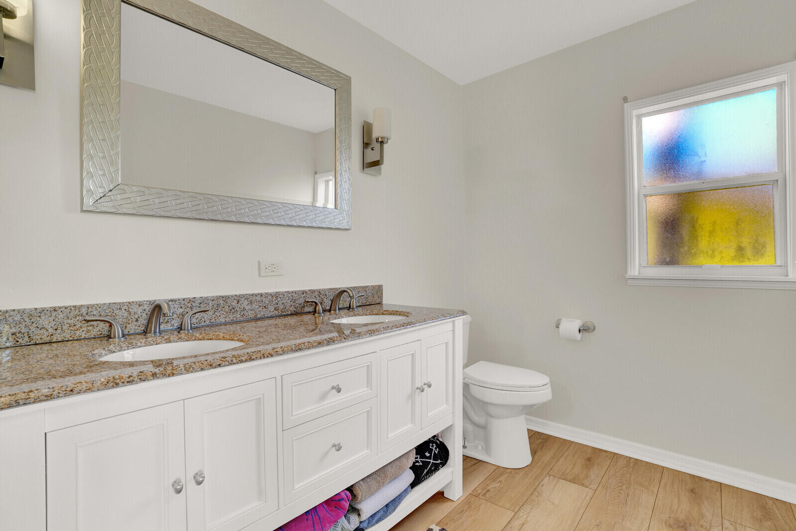 12980 Prosperity Farms Road Palm Beach Gardens, FL 33410 - Photo 25 of 55 a bathroom with a granite countertop sink and a toilet