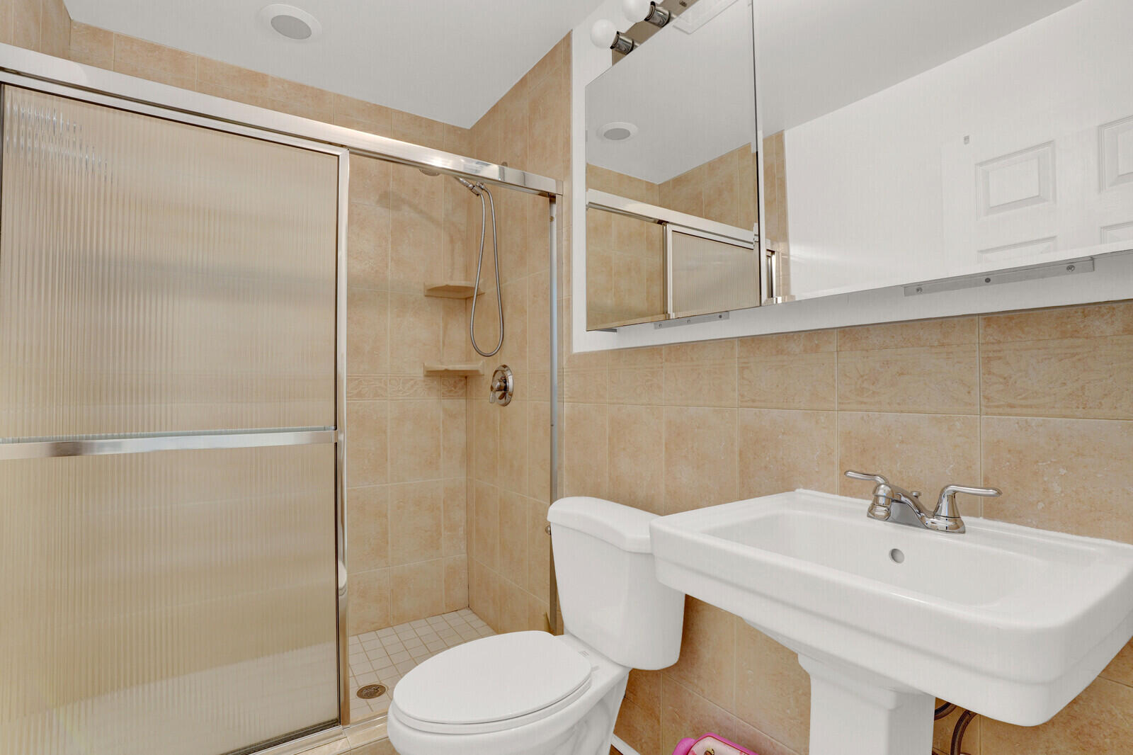 12980 Prosperity Farms Road Palm Beach Gardens, FL 33410 - Photo 29 of 55 a bathroom with a sink toilet and shower