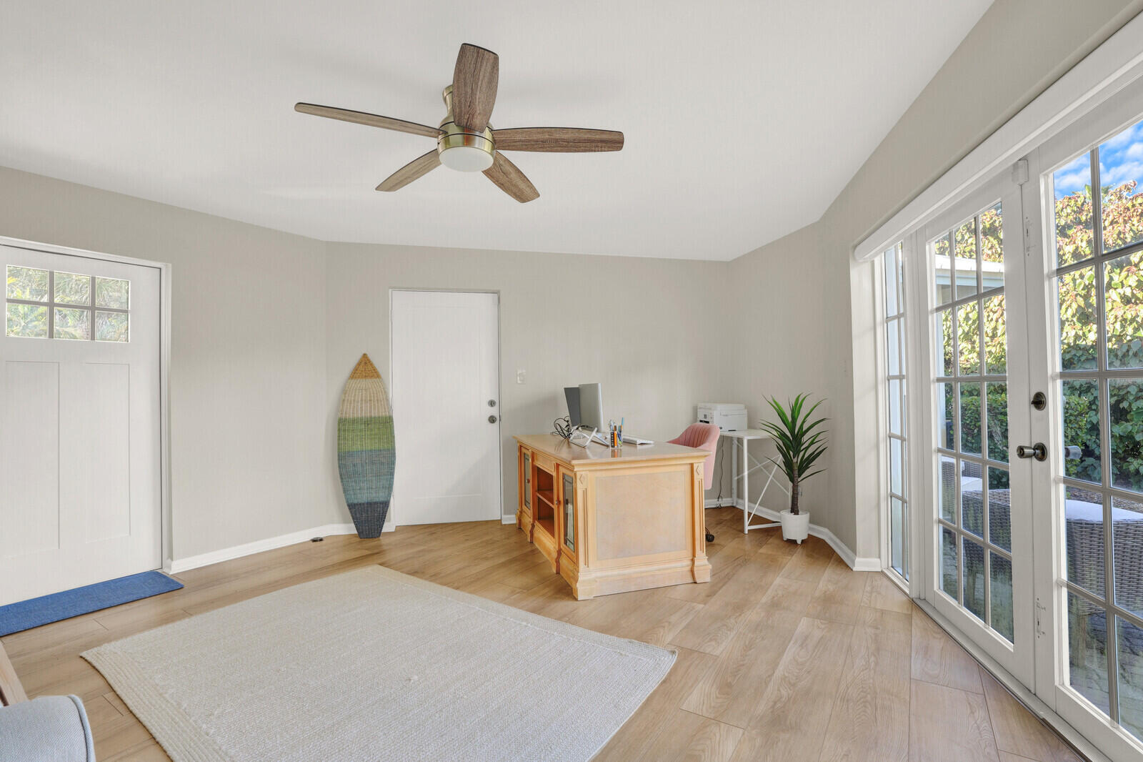 12980 Prosperity Farms Road Palm Beach Gardens, FL 33410 - Photo 30 of 55 a living room with furniture and a large window