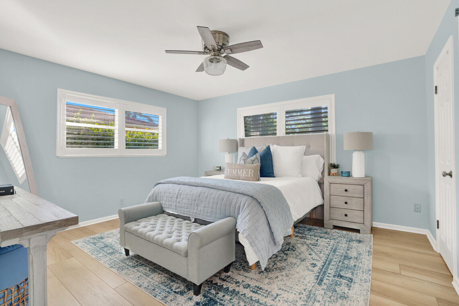 12980 Prosperity Farms Road Palm Beach Gardens, FL 33410 - Photo 33 of 55 a spacious bedroom with a bed and a couch
