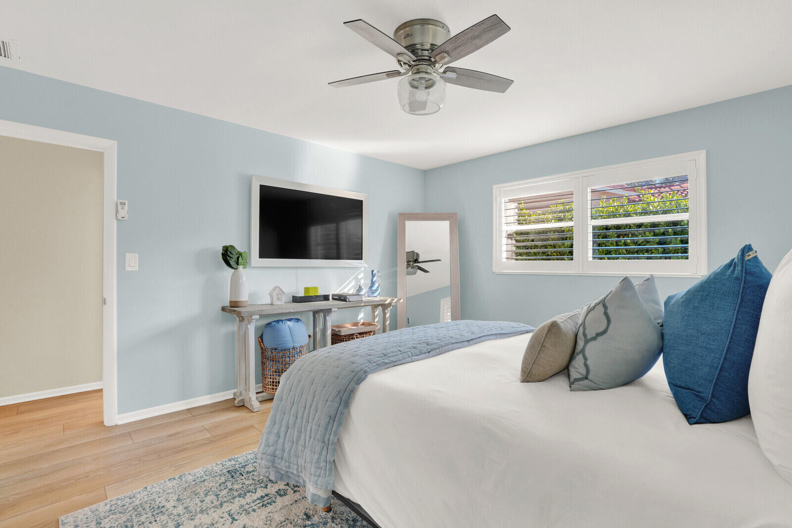 12980 Prosperity Farms Road Palm Beach Gardens, FL 33410 - Photo 34 of 55 a bedroom with a bed and a flat screen tv
