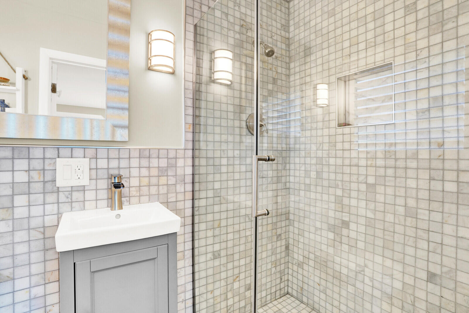 12980 Prosperity Farms Road Palm Beach Gardens, FL 33410 - Photo 36 of 55 a bathroom with a sink a mirror and shower