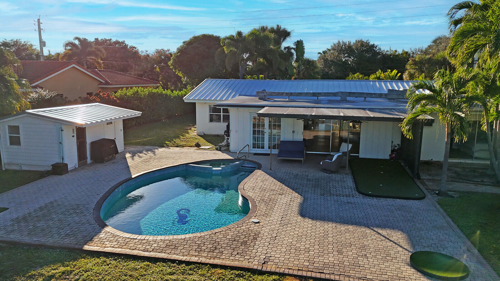 12980 Prosperity Farms Road Palm Beach Gardens, FL 33410 - Photo 45 of 55 swimming pool view with a seating space